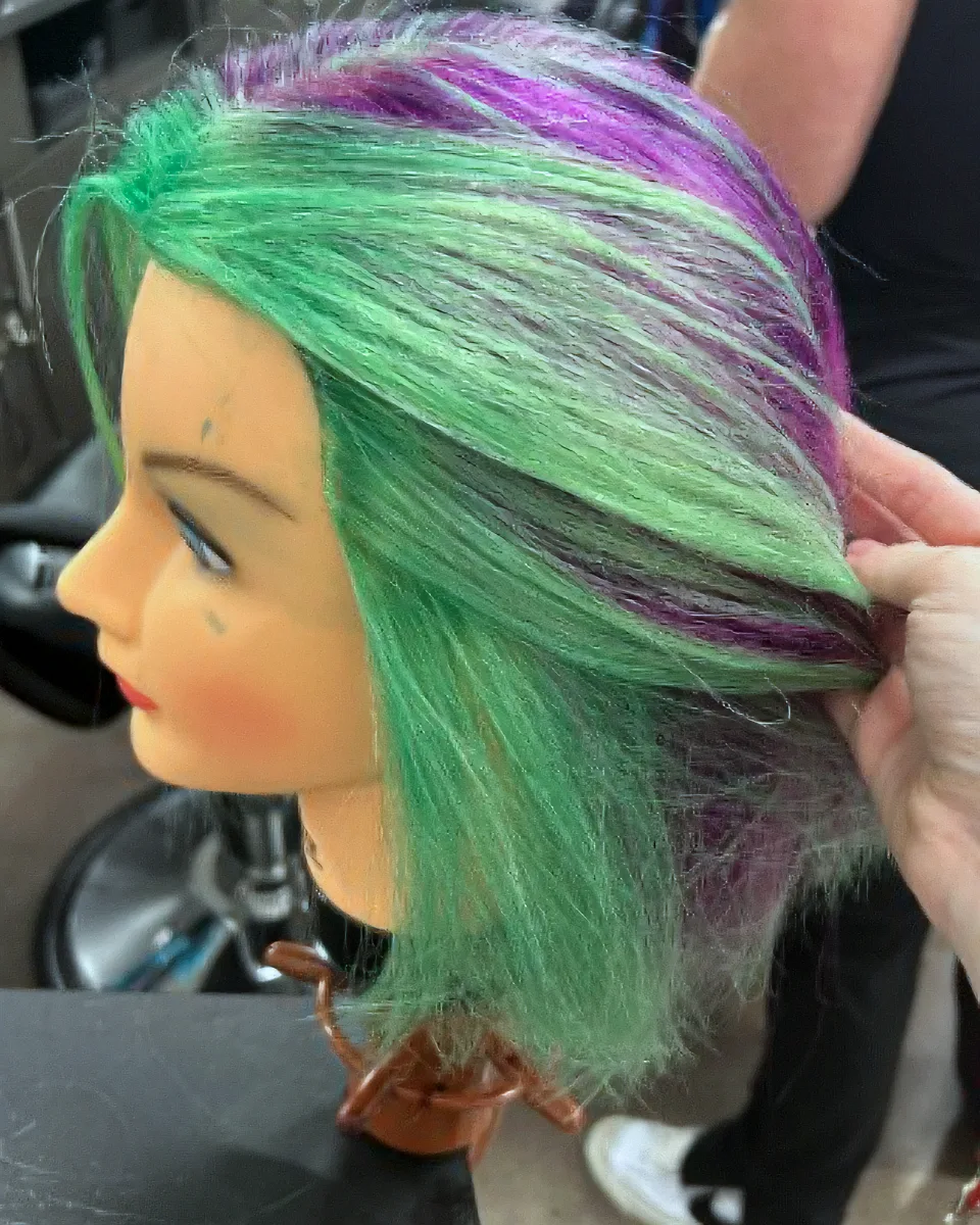 Green and violet placement on a mannequin, side profile